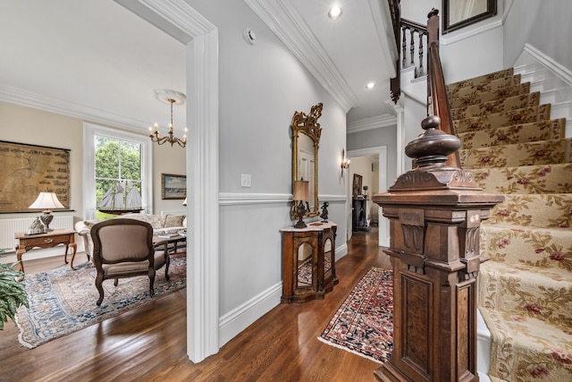 58 Church St, Belfast, ME 04915 - stairs featuring radiator heating unit, a chandelier, crown molding, wood finished floors, and recessed lighting