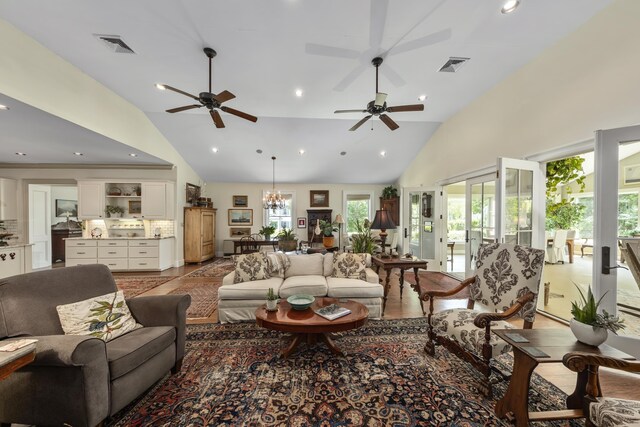58 Church St, Belfast, ME 04915 - living area featuring high vaulted ceiling, ceiling fan, recessed lighting, and a chandelier