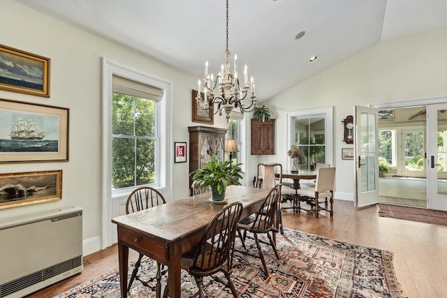 58 Church St, Belfast, ME 04915 - dining area with vaulted ceiling, a chandelier, hardwood / wood-style flooring, and french doors