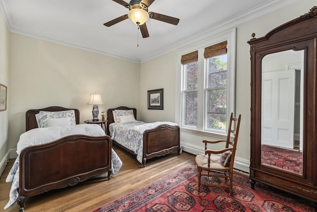 58 Church St, Belfast, ME 04915 - bedroom featuring wood finished floors, ornamental molding, and ceiling fan
