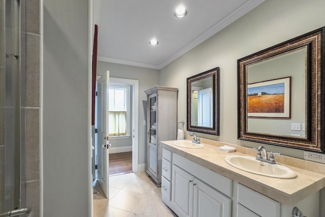 58 Church St, Belfast, ME 04915 - bathroom featuring ornamental molding, double vanity, and tile patterned flooring