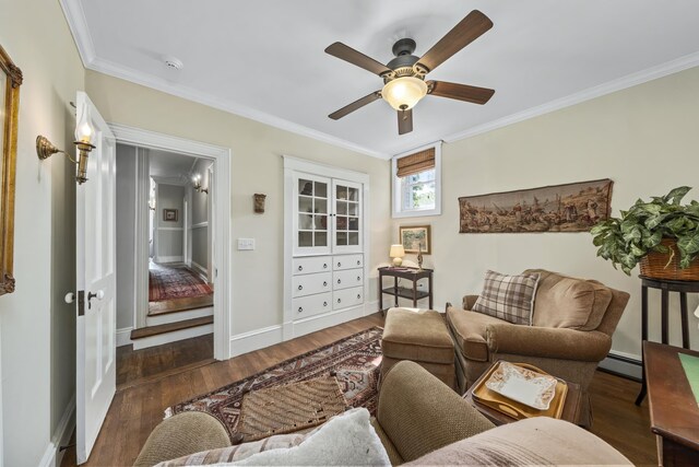 58 Church St, Belfast, ME 04915 - living area featuring a baseboard heating unit, ornamental molding, wood finished floors, and a ceiling fan