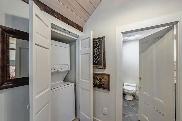 58 Church St, Belfast, ME 04915 - washroom with stacked washing machine and dryer, tile patterned floors, and wood ceiling
