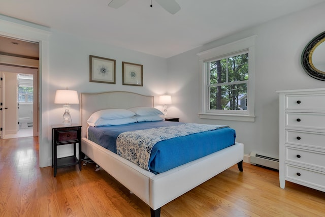 13 Norwood Ln, Kennebunkport, ME 04046 - bedroom featuring a baseboard radiator, light wood-style floors, and ceiling fan
