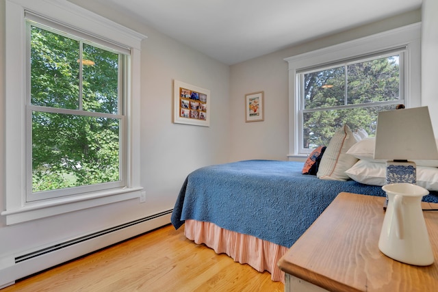 13 Norwood Ln, Kennebunkport, ME 04046 - bedroom featuring baseboard heating and light wood finished floors