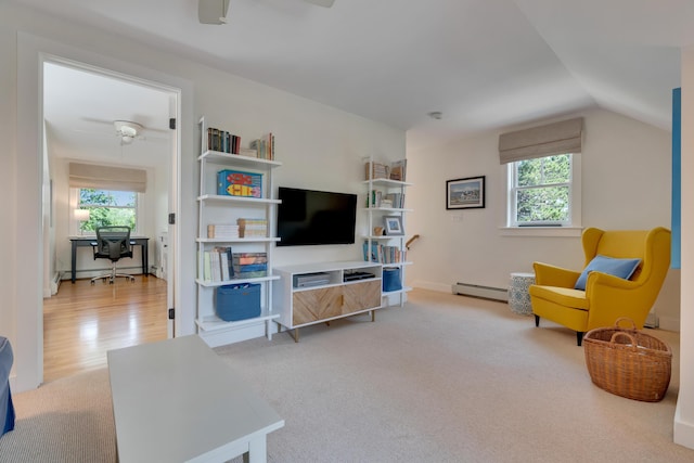 13 Norwood Ln, Kennebunkport, ME 04046 - living area featuring ceiling fan, a baseboard radiator, healthy amount of natural light, and lofted ceiling