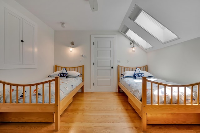 13 Norwood Ln, Kennebunkport, ME 04046 - bedroom with a skylight, wood finished floors, vaulted ceiling, and ceiling fan