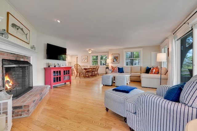 13 Norwood Ln, Kennebunkport, ME 04046 - living area with a fireplace, light wood-type flooring, and ceiling fan