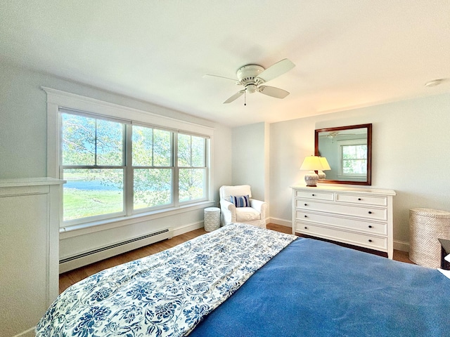 13 Norwood Ln, Kennebunkport, ME 04046 - bedroom with baseboard heating, a ceiling fan, and wood finished floors