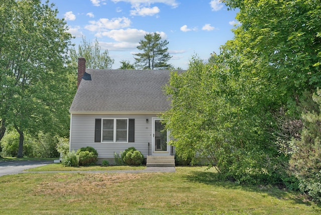 46 Label Ave, Portland, ME 04103 - view of front of house featuring a chimney, a front lawn, and a shingled roof
