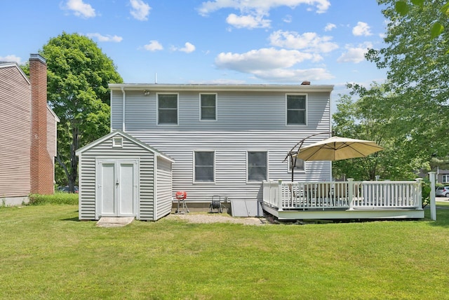 46 Label Ave, Portland, ME 04103 - back of property with a deck, a yard, and a storage shed