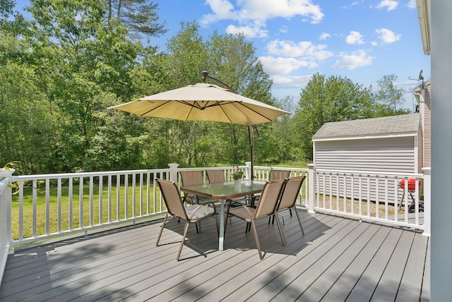46 Label Ave, Portland, ME 04103 - deck with outdoor dining area and a yard