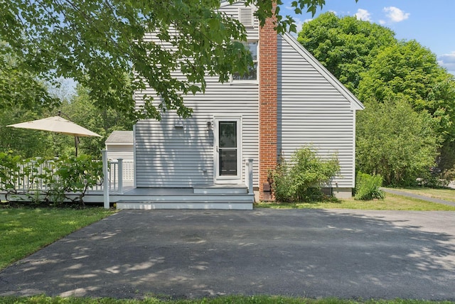 46 Label Ave, Portland, ME 04103 - view of home's exterior with a wooden deck and a chimney