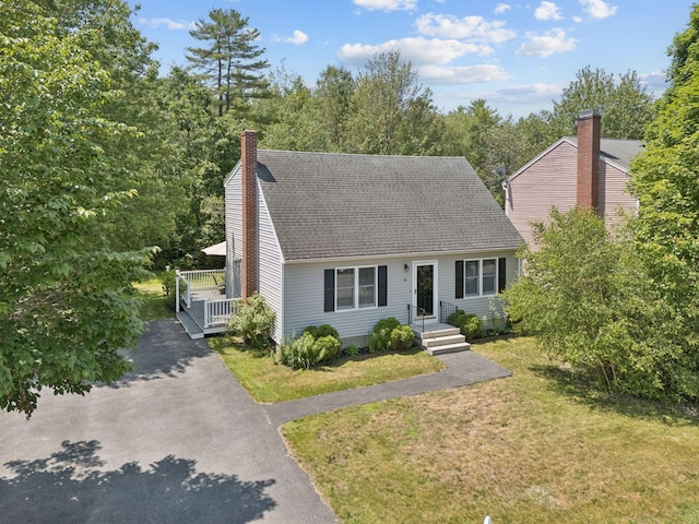 46 Label Ave, Portland, ME 04103 - new england style home featuring a front yard, a chimney, driveway, and roof with shingles
