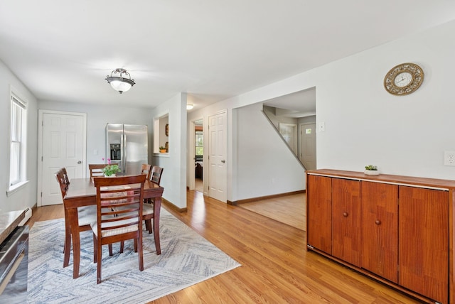 46 Label Ave, Portland, ME 04103 - dining room with plenty of natural light and light wood-style floors