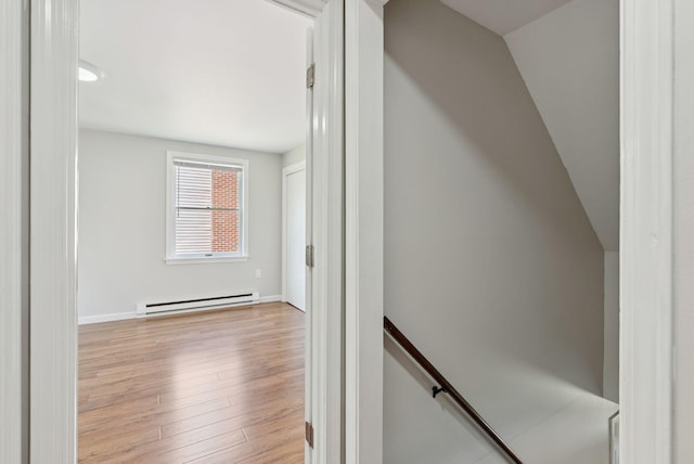 46 Label Ave, Portland, ME 04103 - corridor featuring a baseboard radiator, an upstairs landing, and light wood finished floors