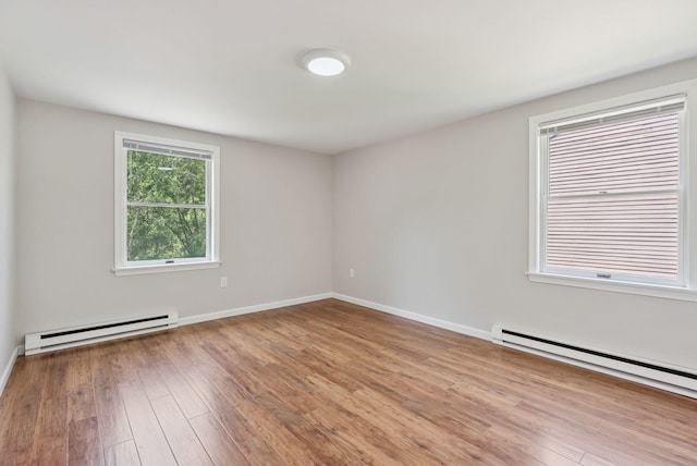 46 Label Ave, Portland, ME 04103 - empty room featuring baseboard heating and wood finished floors