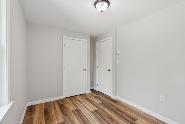 46 Label Ave, Portland, ME 04103 - empty room featuring wood finished floors and baseboards