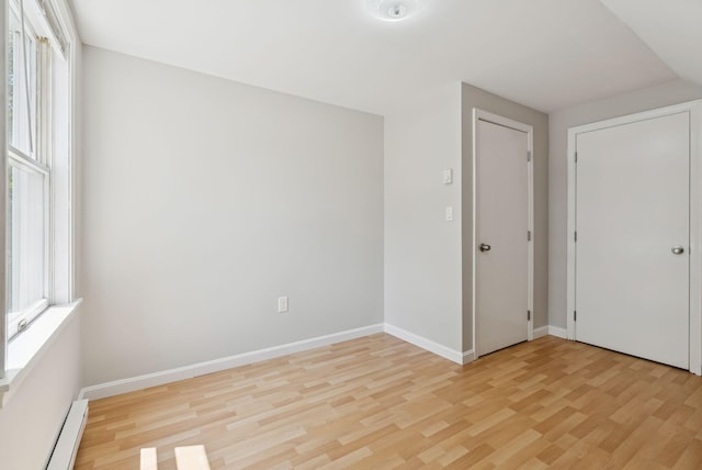 46 Label Ave, Portland, ME 04103 - unfurnished room featuring a baseboard radiator and light wood finished floors