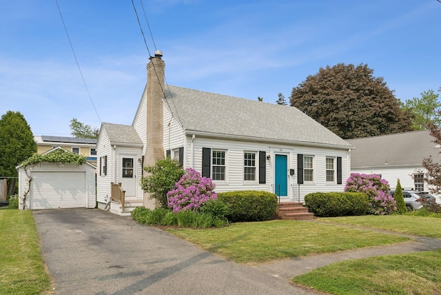 54 Vannah Ave, Portland, ME 04103 - cape cod home featuring an outdoor structure, entry steps, a chimney, a front yard, and driveway