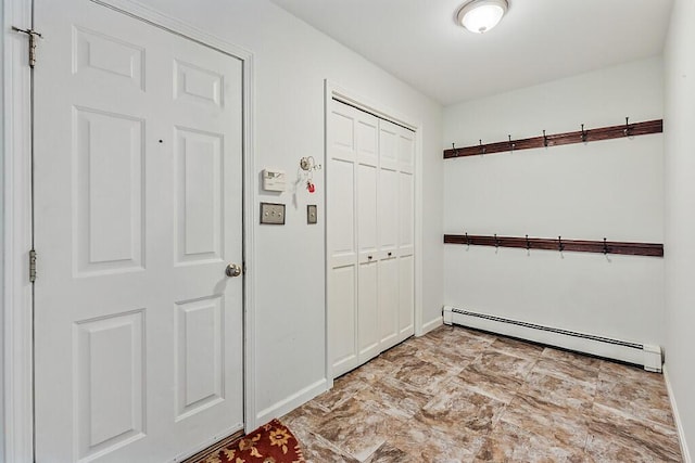 4 Acorn Ln, Lewiston, ME 04240 - entryway with a baseboard heating unit and baseboards