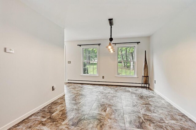 4 Acorn Ln, Lewiston, ME 04240 - unfurnished room with baseboard heating and stone finish flooring