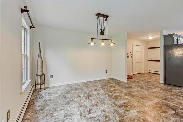 4 Acorn Ln, Lewiston, ME 04240 - empty room with plenty of natural light and baseboard heating