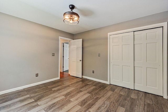4 Acorn Ln, Lewiston, ME 04240 - unfurnished bedroom with wood finished floors and a closet