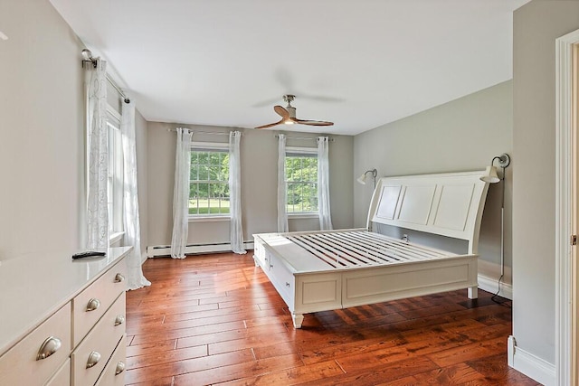 4 Acorn Ln, Lewiston, ME 04240 - bedroom with baseboard heating, wood-type flooring, and a ceiling fan