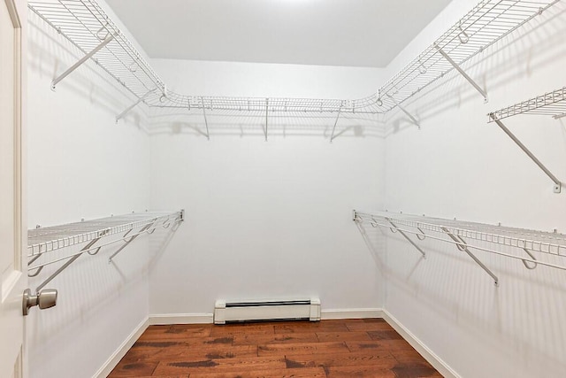 4 Acorn Ln, Lewiston, ME 04240 - spacious closet featuring a baseboard heating unit and dark wood-style flooring