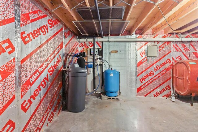 4 Acorn Ln, Lewiston, ME 04240 - unfinished basement featuring heating fuel, a water pressure tank, and a water softener system