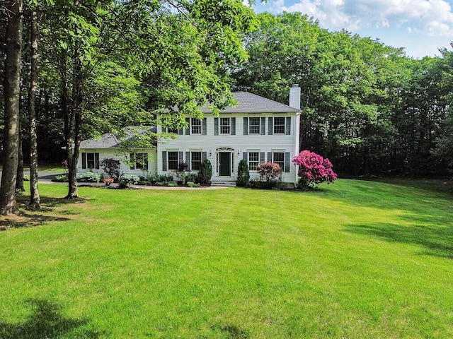 4 Acorn Ln, Lewiston, ME 04240 - colonial home featuring a chimney and a front yard
