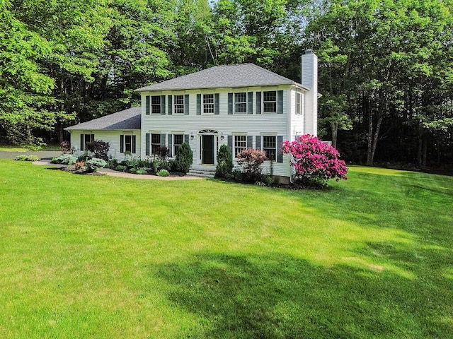 4 Acorn Ln, Lewiston, ME 04240 - colonial inspired home featuring a chimney and a front yard