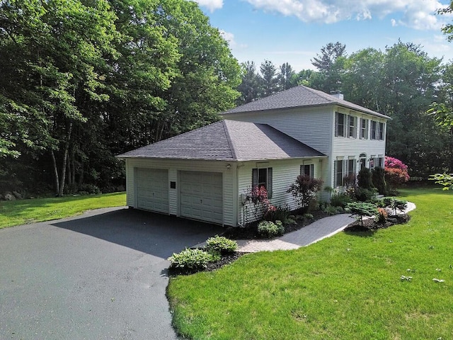 4 Acorn Ln, Lewiston, ME 04240 - view of side of property with roof with shingles, a yard, driveway, and a garage