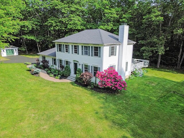 4 Acorn Ln, Lewiston, ME 04240 - colonial inspired home featuring a chimney, a front lawn, roof with shingles, and entry steps