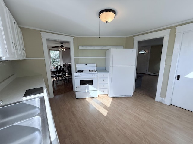 21 Peary Ter, South Portland, ME 04106 - kitchen featuring white appliances, light wood-style flooring, white cabinetry, and crown molding