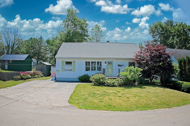 12 Fillmore Ave, South Portland, ME 04106 - view of front of home featuring driveway and a front lawn