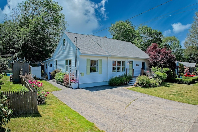 12 Fillmore Ave, South Portland, ME 04106 - bungalow-style home with driveway and a shingled roof