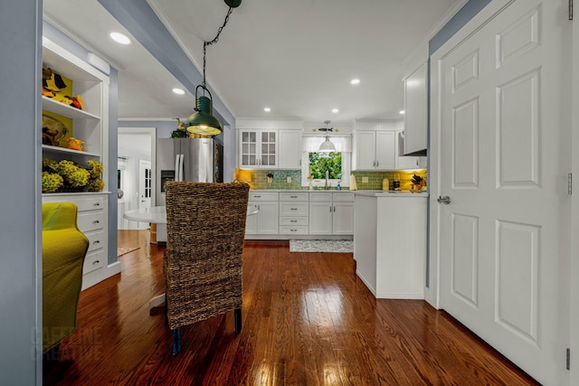 12 Fillmore Ave, South Portland, ME 04106 - kitchen featuring dark wood finished floors, tasteful backsplash, white cabinetry, glass insert cabinets, and light countertops