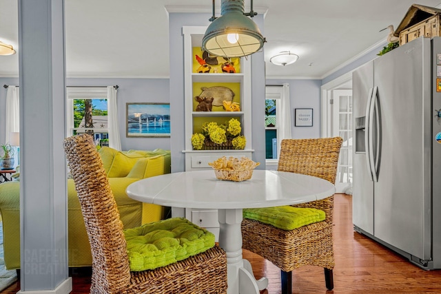 12 Fillmore Ave, South Portland, ME 04106 - dining space featuring ornamental molding and wood finished floors