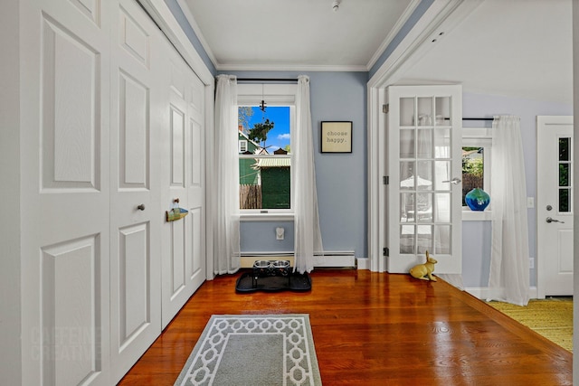 12 Fillmore Ave, South Portland, ME 04106 - entrance foyer with wood finished floors, baseboard heating, and ornamental molding
