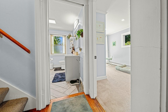 12 Fillmore Ave, South Portland, ME 04106 - hall featuring stairs, wood finished floors, and a baseboard radiator