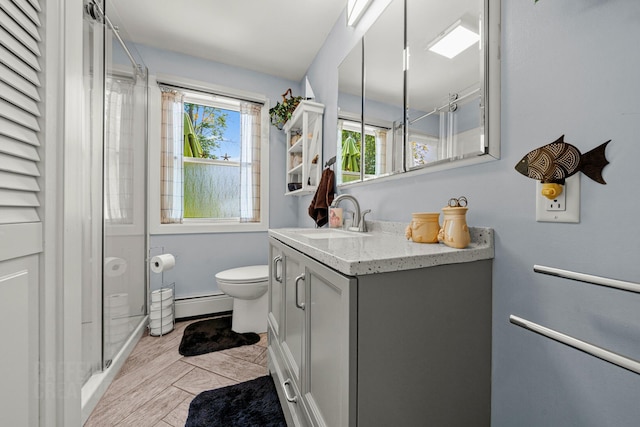 12 Fillmore Ave, South Portland, ME 04106 - full bathroom featuring vanity, a shower stall, and a baseboard radiator