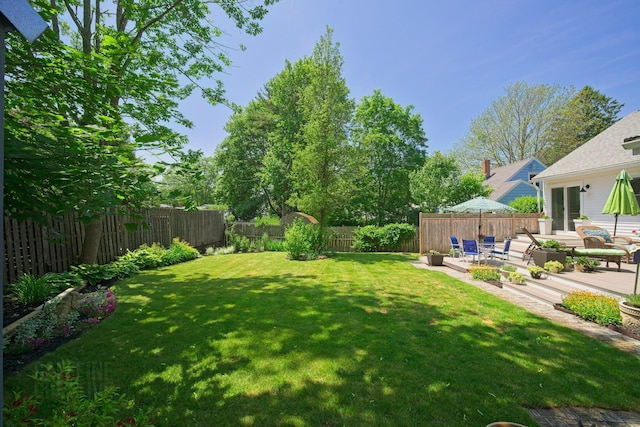12 Fillmore Ave, South Portland, ME 04106 - fenced backyard with a patio area