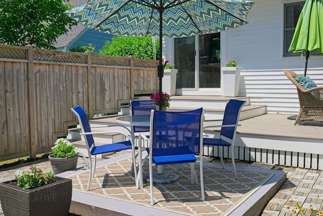 12 Fillmore Ave, South Portland, ME 04106 - deck with a patio and outdoor dining area