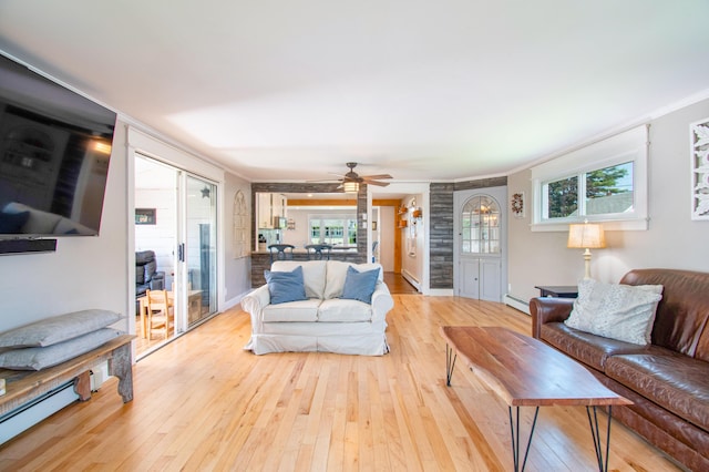 1 Madison St, Augusta, ME 04330 - living room with a baseboard heating unit, hardwood / wood-style floors, crown molding, and a ceiling fan