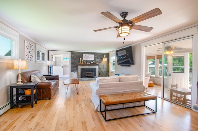 1 Madison St, Augusta, ME 04330 - living area featuring a ceiling fan, ornamental molding, light wood-style flooring, and a fireplace