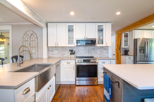 1 Madison St, Augusta, ME 04330 - kitchen featuring appliances with stainless steel finishes, tasteful backsplash, dark wood-type flooring, light countertops, and recessed lighting