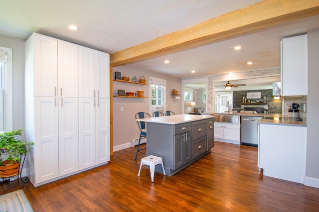 1 Madison St, Augusta, ME 04330 - kitchen featuring dishwasher, a kitchen breakfast bar, gray cabinetry, white cabinets, and dark wood-style floors