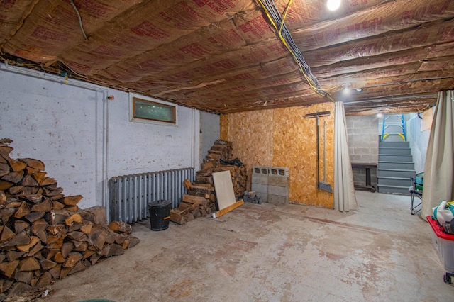 1 Madison St, Augusta, ME 04330 - unfinished basement featuring radiator heating unit and stairs